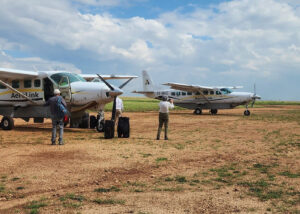 How to reach Queen Elizabeth National Park from Kampala or Entebbe. Compare road travel times, fly-in charters to Kasese, and transfers to Kazinga Wilderness Safari Camp.